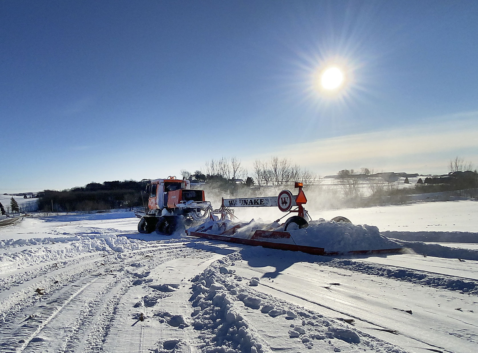 Grooming the snowmobile trail